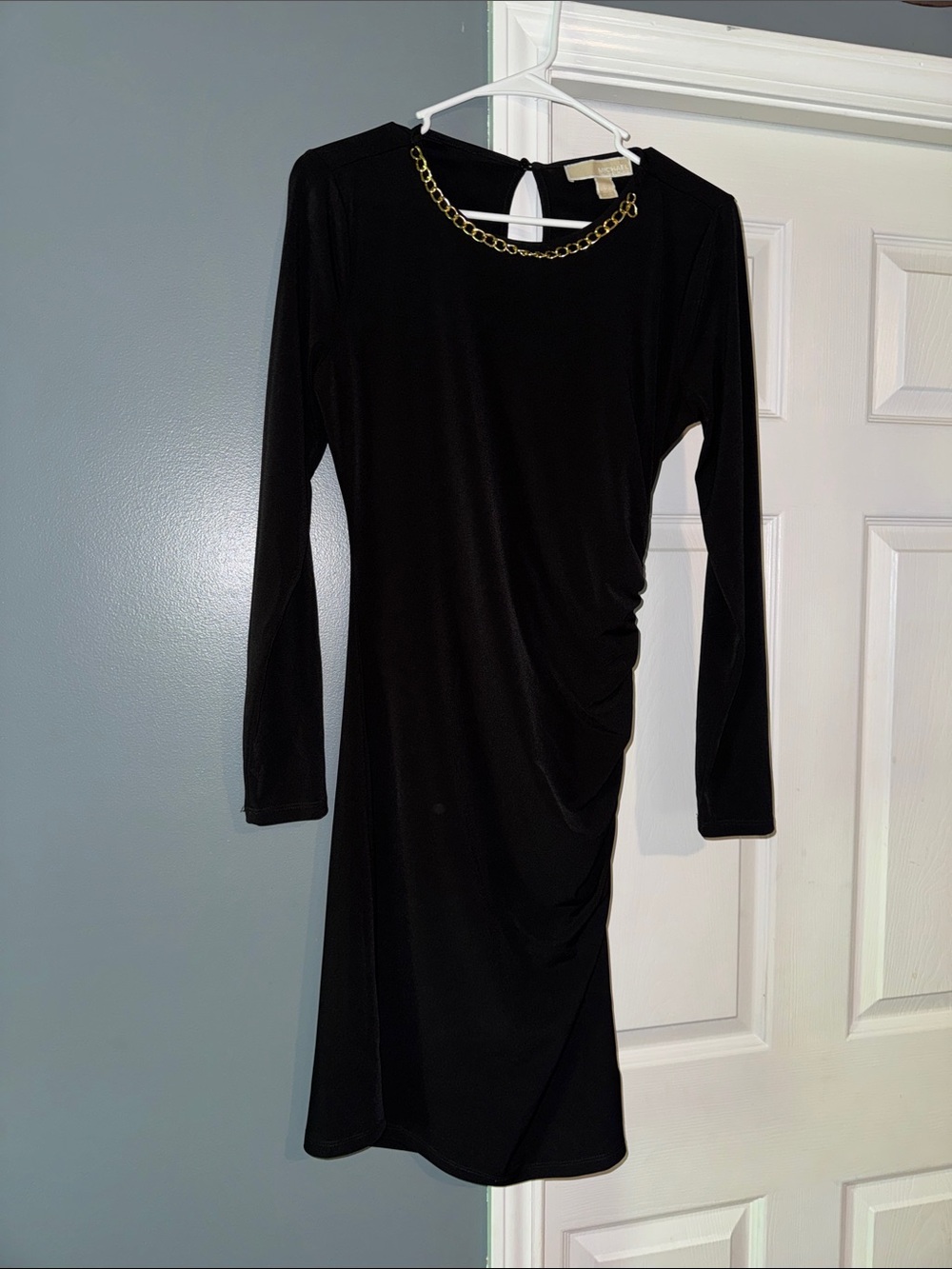 Beautiful black dress with gold accent on neck line
